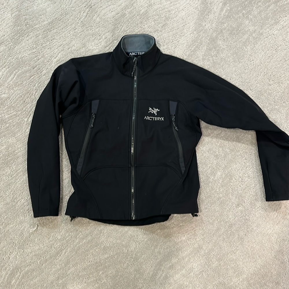 Black soft shell fleece lined Arc’Teryx jacket